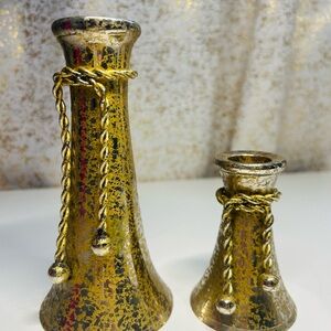 Two beautiful candleholders metal with a rope bow style